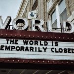 Sign reading "The world is temporarily closed"